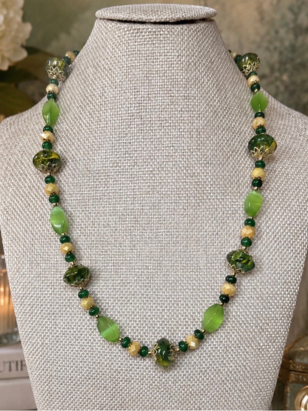 Artisan necklace with various green stones, colored crystal with glass beads.